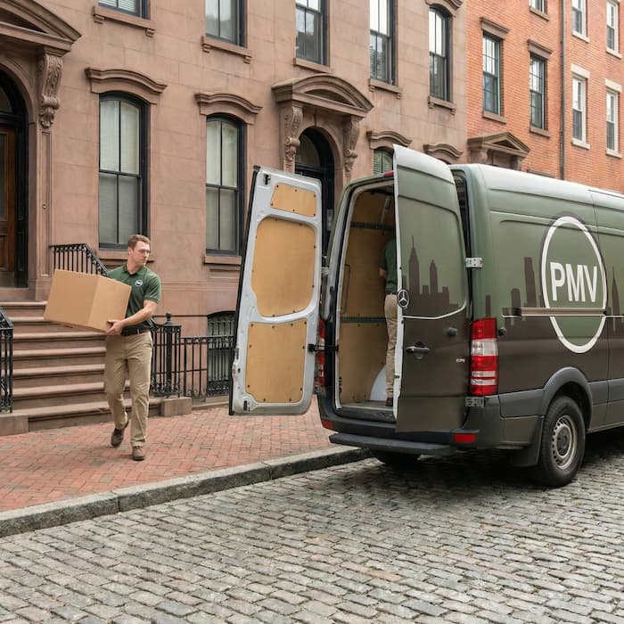 Compact cargo van parked near a Philadelphia apartment entrance